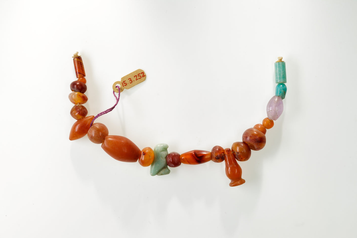 MUGG-099 — , String of beads, hawk amulet and cornflower pendant (ca. 1981–1640 B.C.)